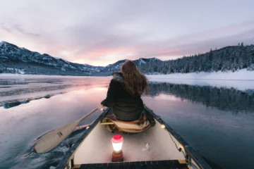 girl riding kayak and enjoy Beautiful view of river