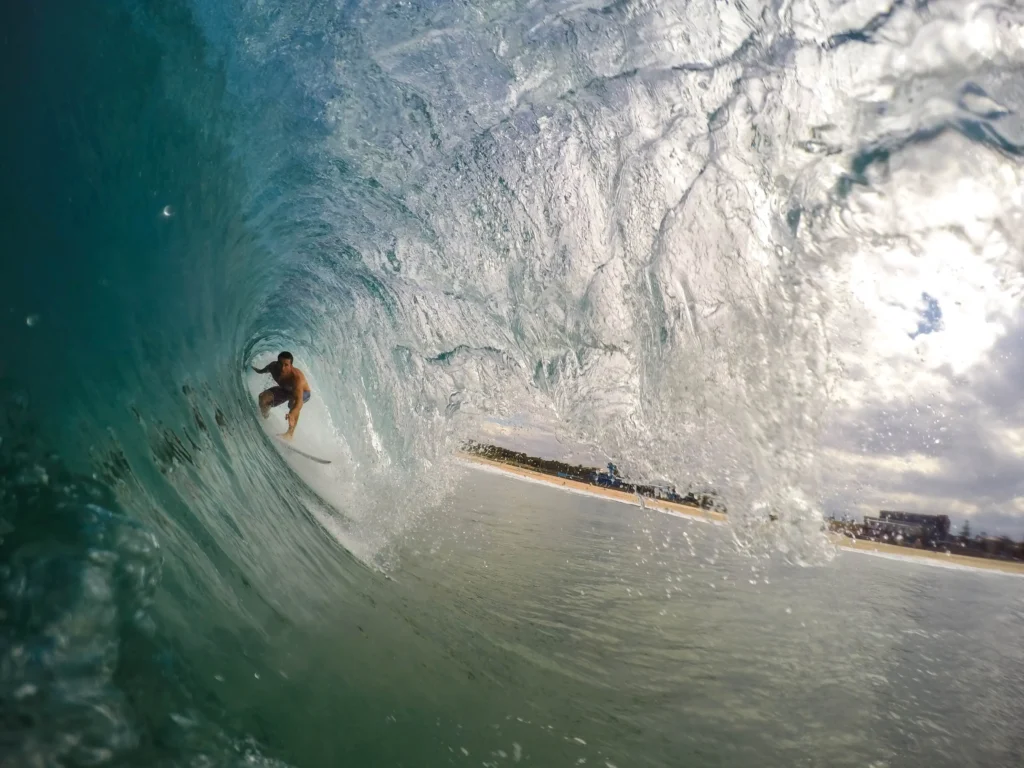 surfing under the wave